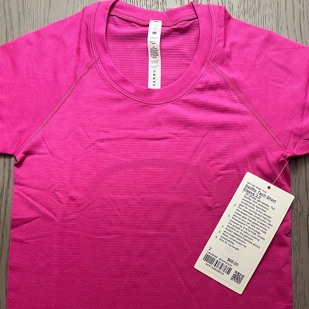 Sonic pink swiftly tech short sleeve shirt size 2